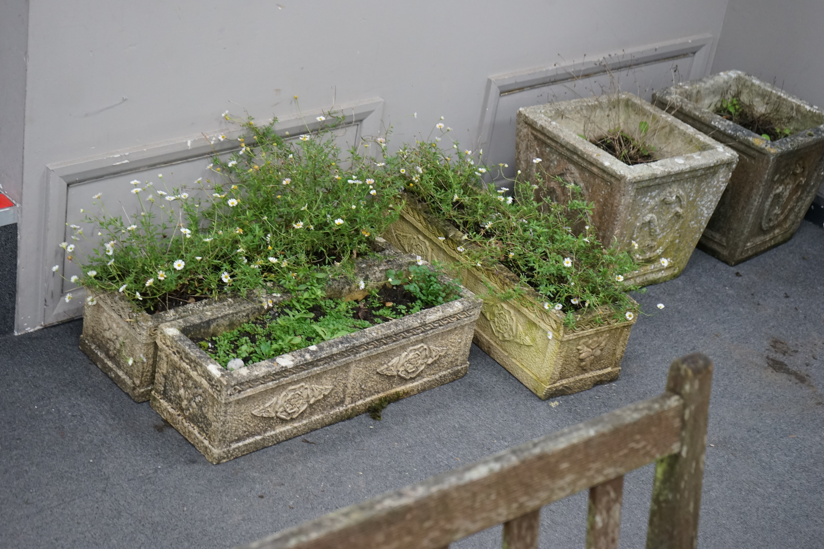 A graduated set of three rectangular reconstituted stone garden planters